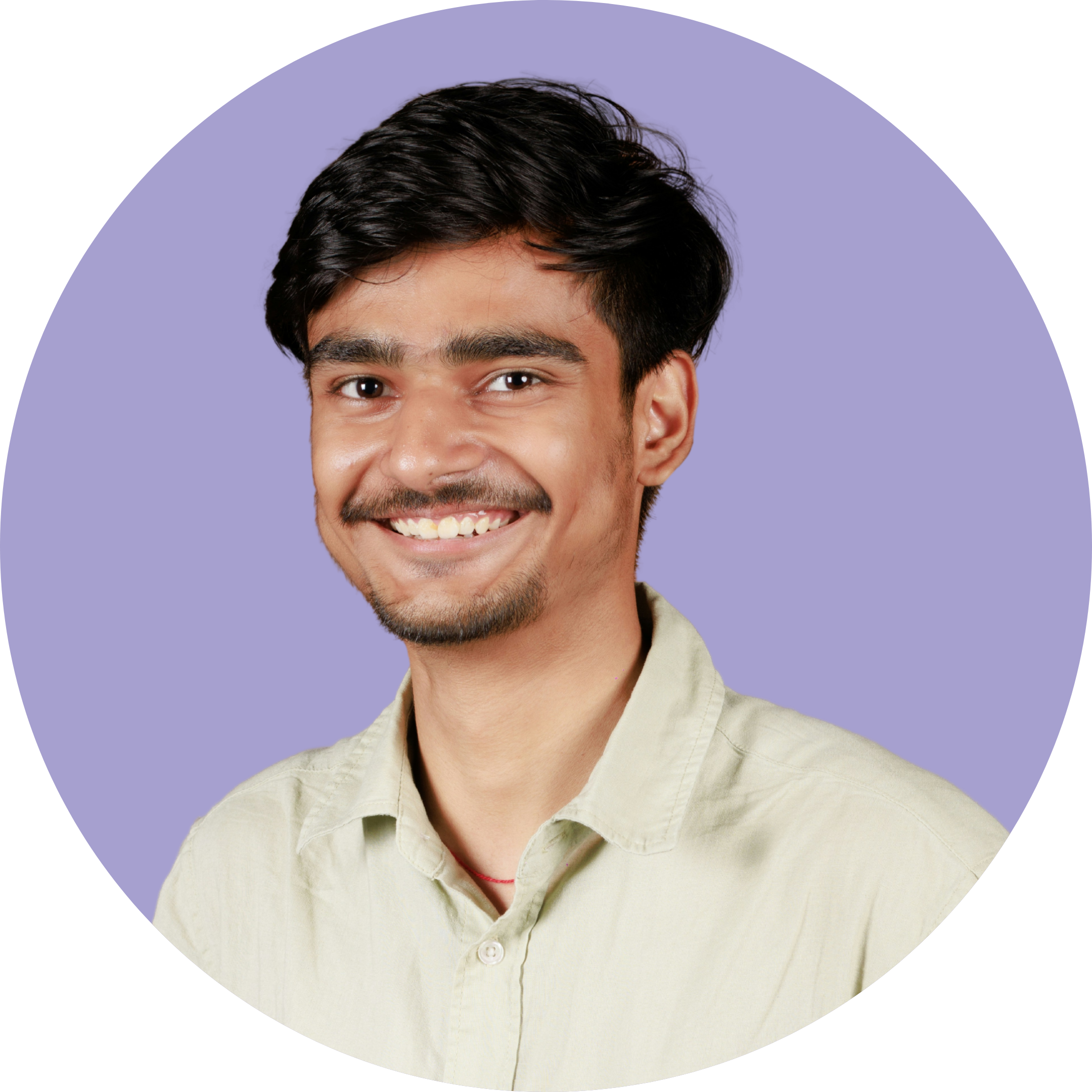 A young man smiling, with short black hair, a beard, wearing a light-colored shirt, against a purple background.